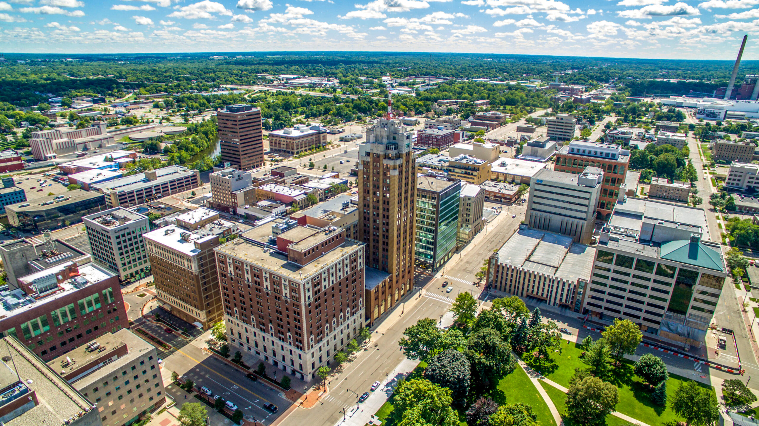 Aerial view of city against cloudy sky, Lansing, Michigan, USA