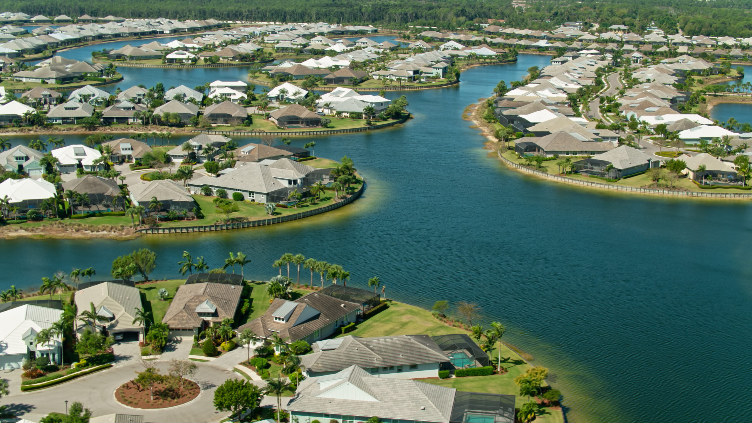 Aerial shot of waterfront homes in Naples, Florida on a clear sunny day
